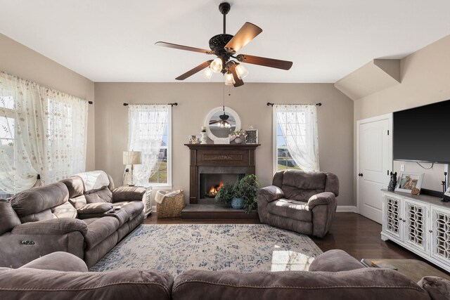 4584 S Mill Ln, Cross Plains, TN 37049 - living area with plenty of natural light, a ceiling fan, dark wood-style flooring, and a warm lit fireplace