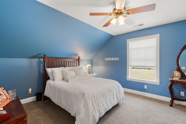 carpeted bedroom with vaulted ceiling and ceiling fan