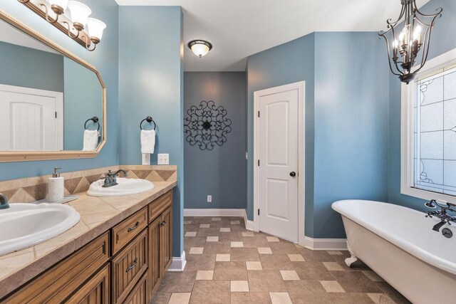 4584 S Mill Ln, Cross Plains, TN 37049 - full bathroom with a chandelier, a soaking tub, and double vanity