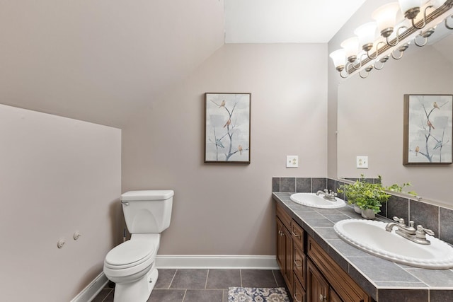 4584 S Mill Ln, Cross Plains, TN 37049 - bathroom featuring double vanity, vaulted ceiling, and tile patterned floors