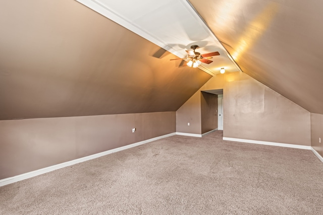 additional living space featuring lofted ceiling, ceiling fan, and carpet floors