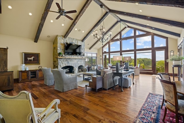 living room featuring high vaulted ceiling, plenty of natural light, beamed ceiling, and a stone fireplace