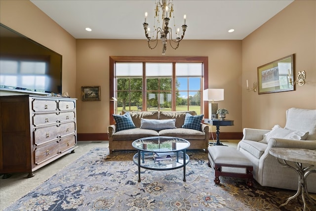 living area with carpet and a notable chandelier