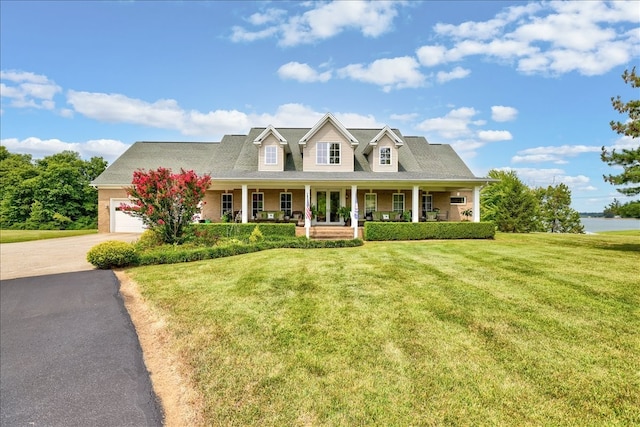 cape cod-style house with covered porch and a front lawn