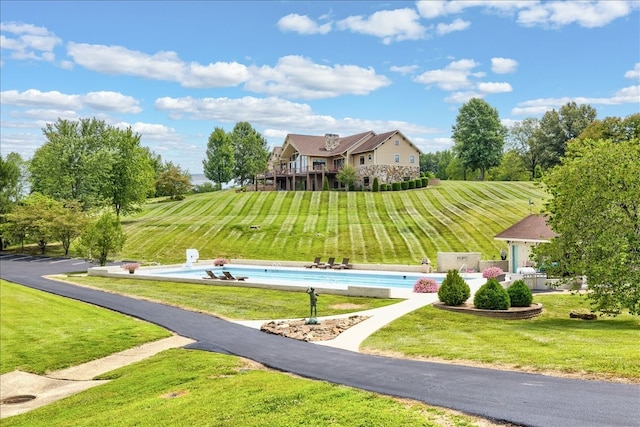 surrounding community featuring a yard