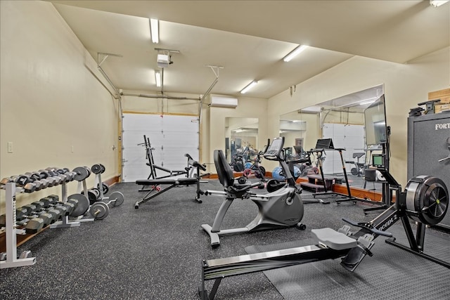 exercise room featuring an AC wall unit