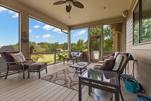 sunroom / solarium with plenty of natural light and ceiling fan