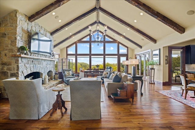 living room featuring a wealth of natural light, dark hardwood / wood-style floors, a stone fireplace, and high vaulted ceiling