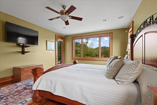 bedroom featuring ceiling fan and hardwood / wood-style flooring