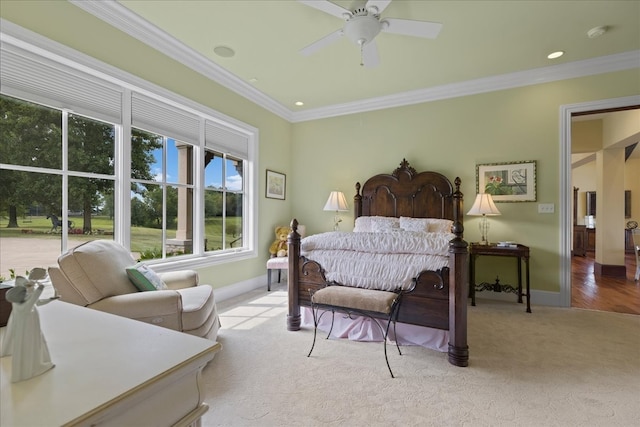 bedroom featuring ornamental molding, wood-type flooring, and ceiling fan