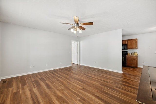 unfurnished room with dark wood-type flooring and ceiling fan