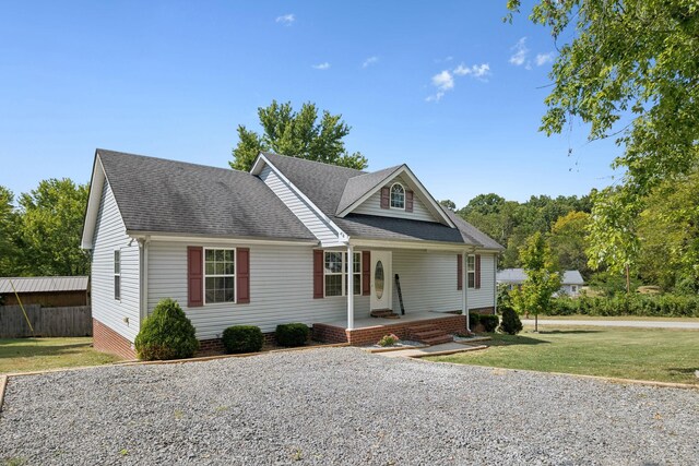 view of front of property featuring a front yard and a porch