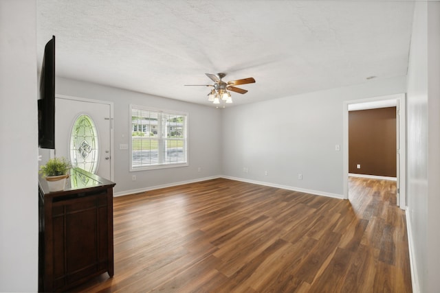 interior space featuring a textured ceiling, hardwood / wood-style floors, and ceiling fan