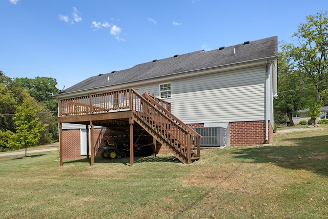 back of property featuring a yard, a deck, and cooling unit