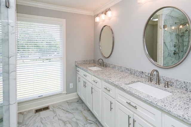 bathroom featuring walk in shower, plenty of natural light, crown molding, and vanity