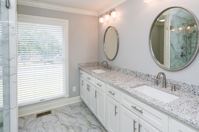 full bath with visible vents, marble finish floor, crown molding, and a sink