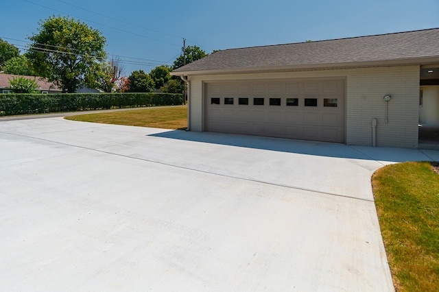 garage featuring a yard