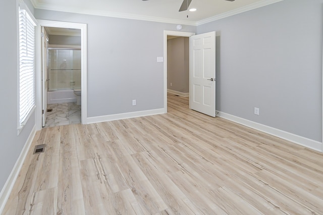 unfurnished bedroom featuring light hardwood / wood-style floors, ceiling fan, connected bathroom, and crown molding