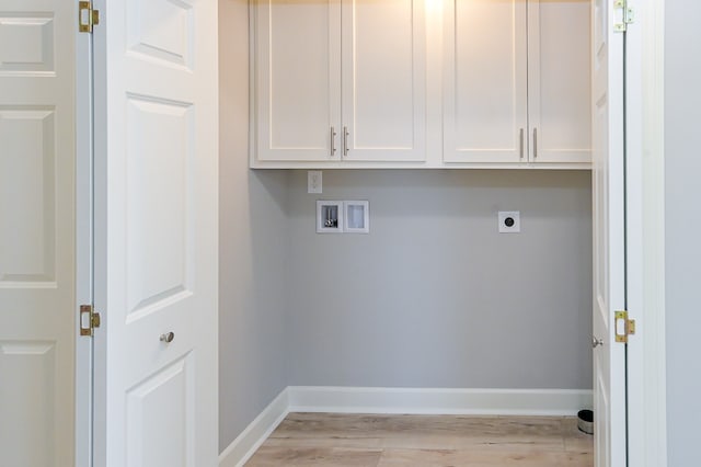 washroom featuring hookup for a washing machine, cabinets, hookup for an electric dryer, and light wood-type flooring