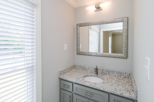 bathroom featuring vanity and ornamental molding