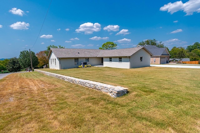 view of front of house with a garage and a front yard