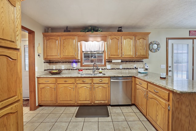 kitchen with dishwasher, a wealth of natural light, kitchen peninsula, and sink