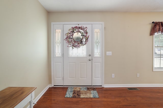 foyer with dark hardwood / wood-style flooring