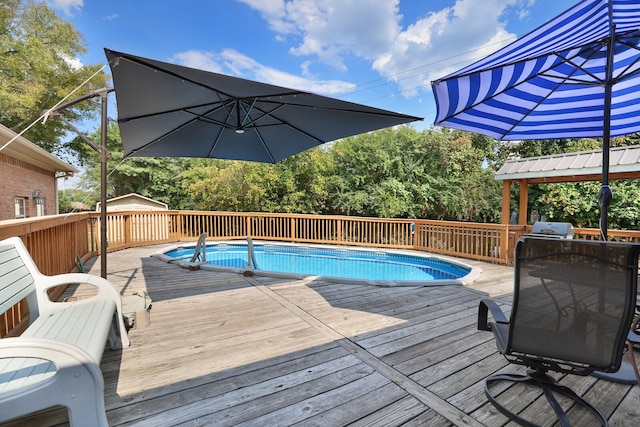 view of pool with a wooden deck