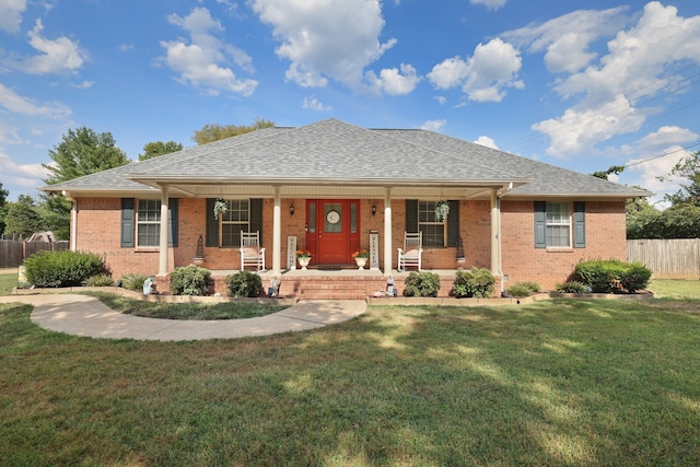 single story home featuring a porch and a front lawn