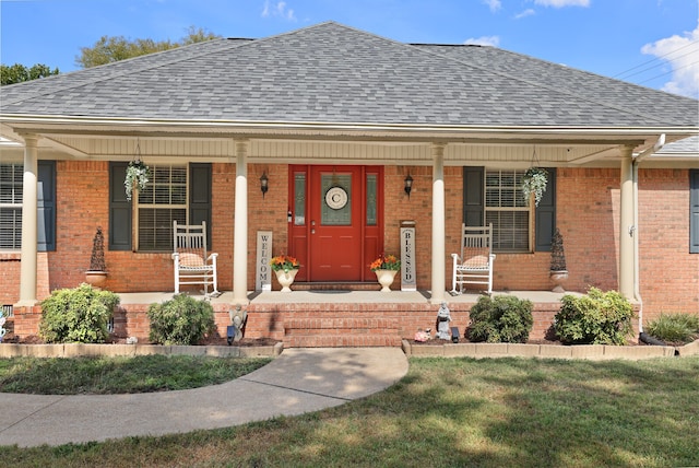 view of front of property with a front lawn and covered porch