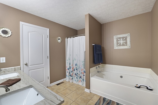 bathroom featuring tile patterned flooring, separate shower and tub, a textured ceiling, and vanity