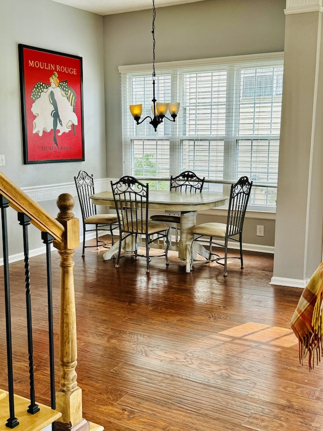 dining room with a notable chandelier and hardwood / wood-style floors