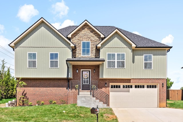 view of front of property featuring a garage and a front lawn