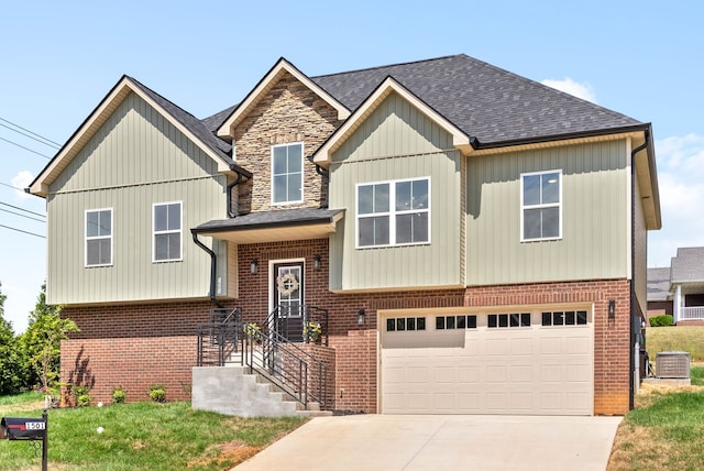 view of front of home featuring central AC unit and a garage