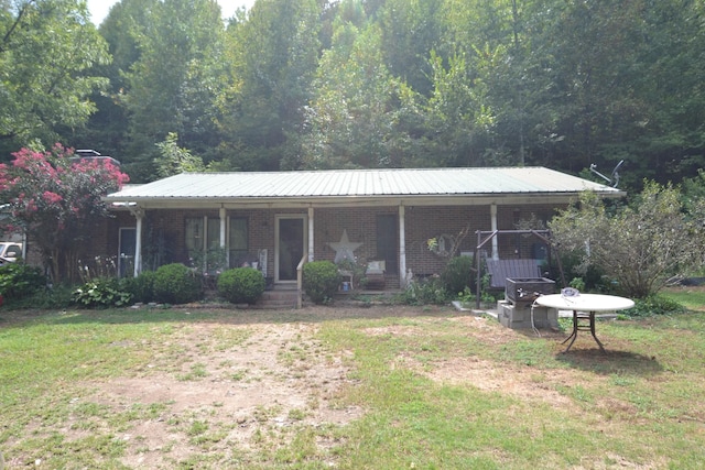 555 Myrick Branch Rd, Pulaski, TN 38478 - ranch-style house featuring covered porch, brick siding, a front yard, and metal roof