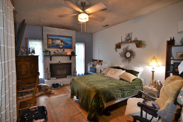 555 Myrick Branch Rd, Pulaski, TN 38478 - bedroom with wood finished floors and a fireplace