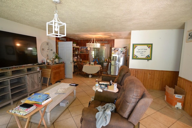 555 Myrick Branch Rd, Pulaski, TN 38478 - living room with wood walls, light tile patterned floors, wainscoting, and a textured ceiling