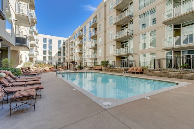 view of swimming pool with a patio area