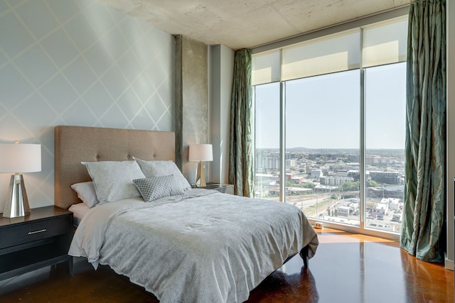 bedroom featuring floor to ceiling windows