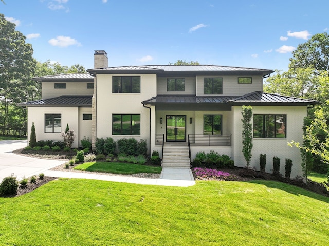 modern farmhouse style home featuring a front yard and a porch