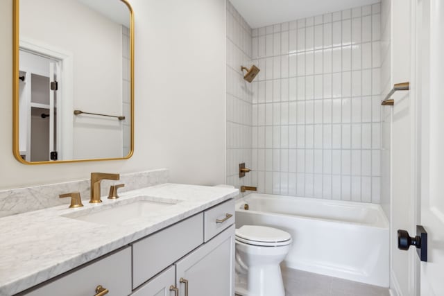 full bathroom with vanity, toilet, and tiled shower / bath