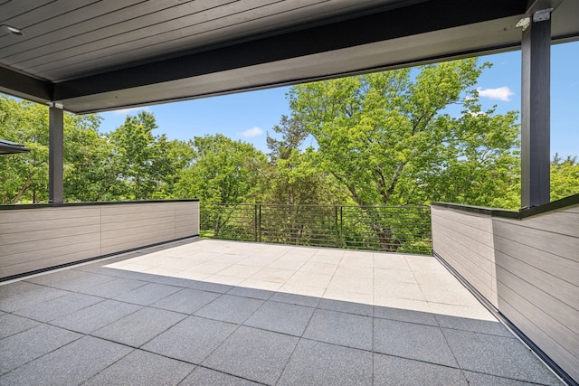 view of patio featuring a balcony