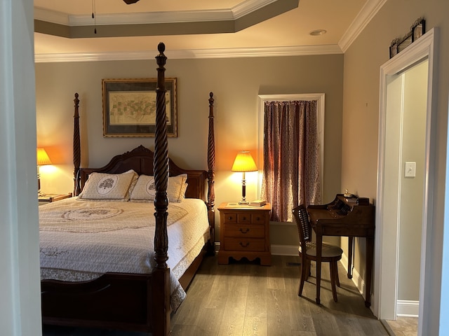 bedroom featuring crown molding and hardwood / wood-style flooring