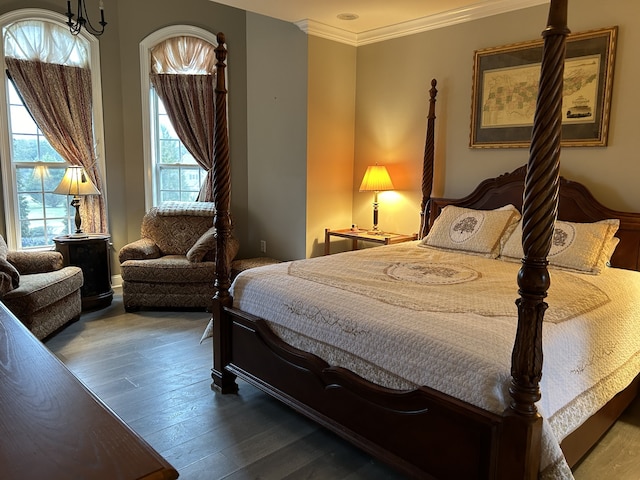 bedroom with hardwood / wood-style flooring and ornamental molding