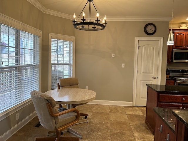 dining room featuring ornamental molding and a notable chandelier