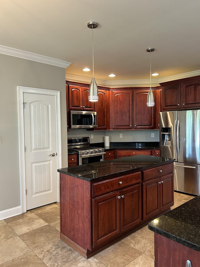 kitchen featuring dark stone countertops, decorative light fixtures, crown molding, a kitchen island, and appliances with stainless steel finishes