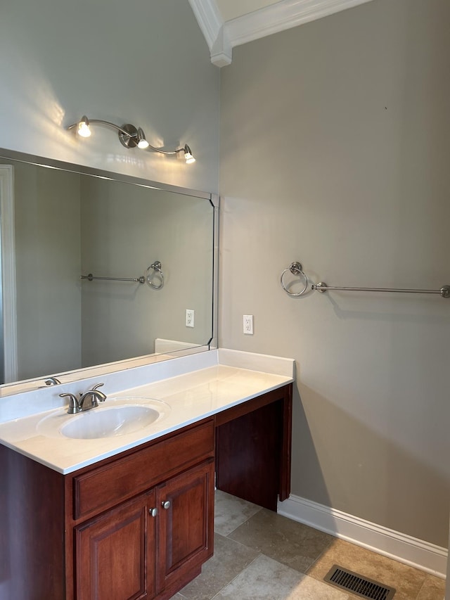 bathroom featuring crown molding, visible vents, baseboards, and vanity