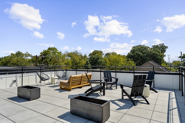 view of patio / terrace featuring an outdoor living space with a fire pit