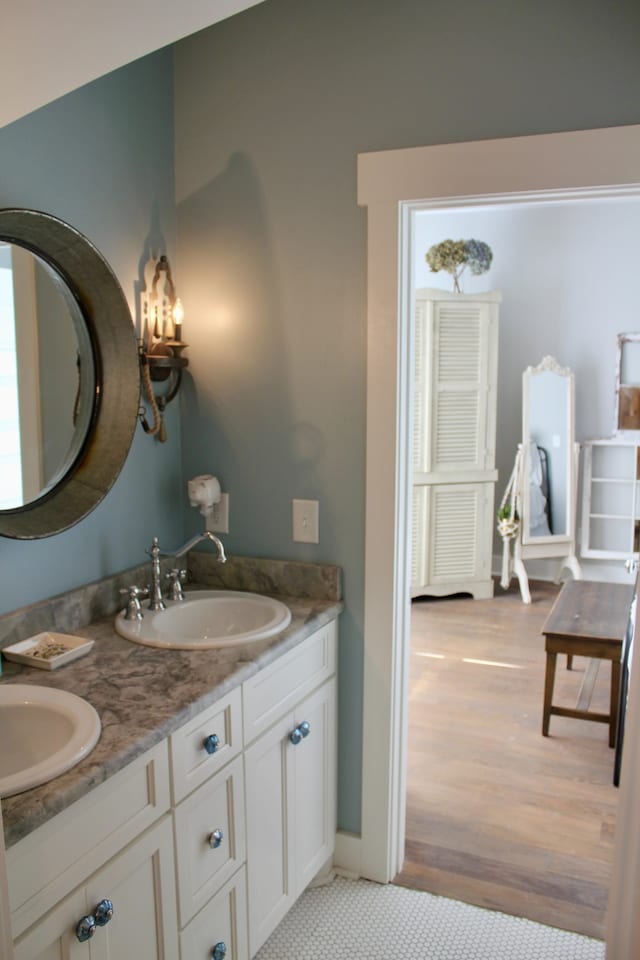 bathroom featuring vanity and hardwood / wood-style floors