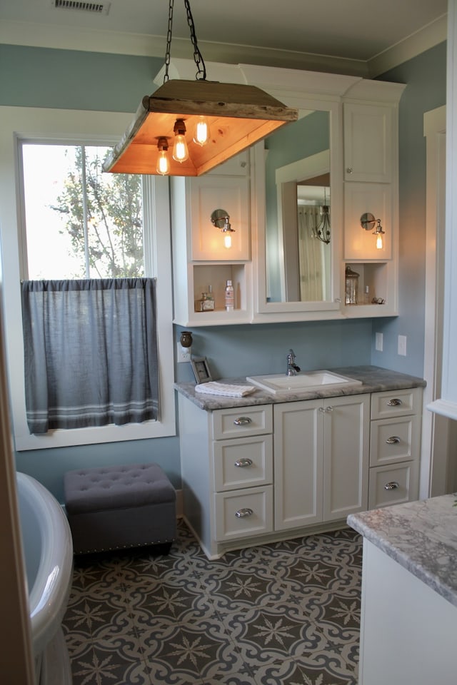 exterior space with vanity and ornamental molding